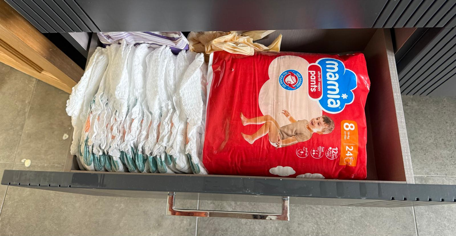 Family drawer organised with nappies stood in neat rows for quick daily access